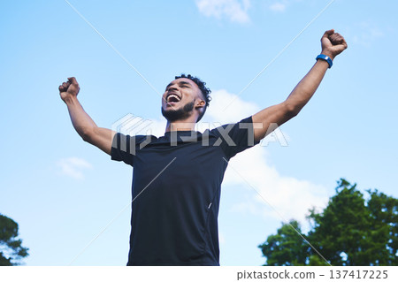 Runner man, fist celebration and nature with goals, achievement and pride for race, success and contest. Young athlete guy, happy winner and outdoor for fitness, competition and freedom in summer Runner man, fist celebration and nature with goals, achievement and pride for race, success and contest. Young athlete guy, happy winner and outdoor for fitness, competition and freedom in summer 137417225