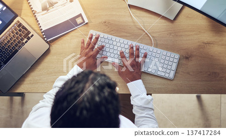 Business person, hands and computer for planning, copywriting and marketing research at office desk above. Worker, writer or editor typing on desktop keyboard for social media branding or information Business person, hands and computer for planning, copywriting and marketing research at office desk above. Worker, writer or editor typing on desktop keyboard for social media branding or information 137417284