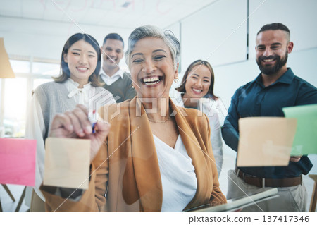 Business people, writing and planning on glass board for marketing timeline, calendar and presentation ideas in meeting. Professional manager or staff workflow, sticky notes and scrum or agile goals 137417346