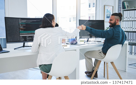 People, fist bump and coding, computer screen and software development or programming success in IT. Developer or programmer support, motivation or collaboration with coding or information technology People, fist bump and coding, computer screen and software development or programming success in IT. Developer or programmer support, motivation or collaboration with coding or information technology 137417471