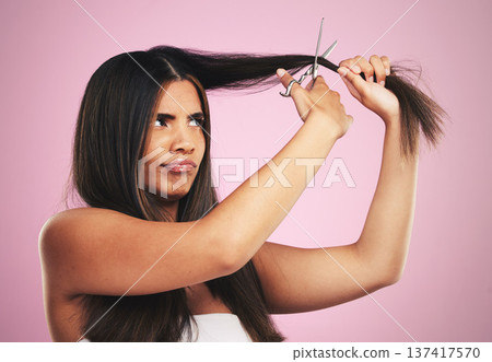 Hair cut, scissors and frustrated woman with beauty tool and DIY treatment in a studio. Growth issue, annoyed and Brazilian hairstyle with female model from Brazil with equipment and pink background Hair cut, scissors and frustrated woman with beauty tool and DIY treatment in a studio. Growth issue, annoyed and Brazilian hairstyle with female model from Brazil with equipment and pink background 137417570