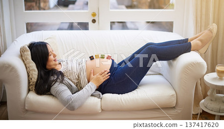 Couch, pregnant woman or wooden blocks in home, prenatal love or bonding for maternal attachment. Emotional connection, relax or person with pregnancy news, toys or care for relationship development 137417620
