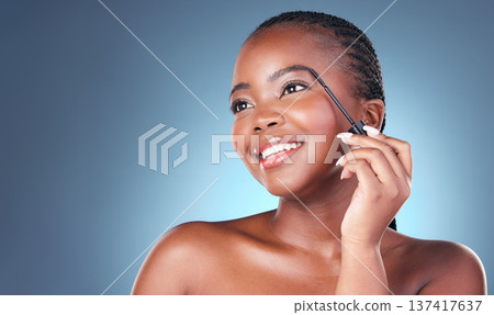 Face brush, eyebrow and beauty of a woman with dermatology, natural makeup and smile. Happy African person on blue background with brow cosmetics, mascara and facial glow for self care in studio Face brush, eyebrow and beauty of a woman with dermatology, natural makeup and smile. Happy African person on blue background with brow cosmetics, mascara and facial glow for self care in studio 137417637