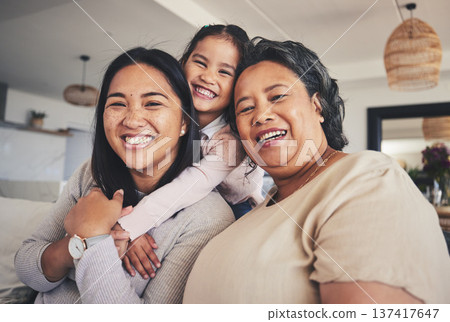 Hug, women and generations with portrait of family on sofa for smile, bonding and support. Happy, relax and grandparent with mother and child in living room at home for calm, care and peace together 137417647