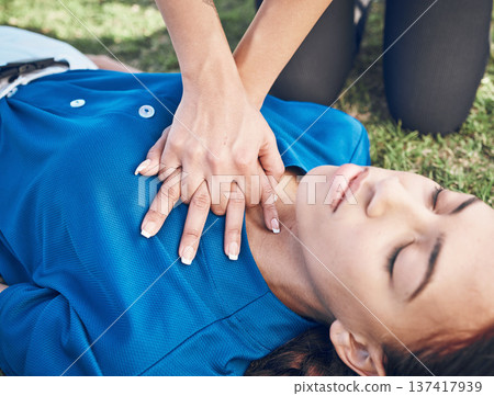 CPR, lungs press and woman hands on heart on sport, fitness and game field with accident and emergency. Training, paramedic and medical help for breathe from injury with first aid and athlete outdoor CPR, lungs press and woman hands on heart on sport, fitness and game field with accident and emergency. Training, paramedic and medical help for breathe from injury with first aid and athlete outdoor 137417939