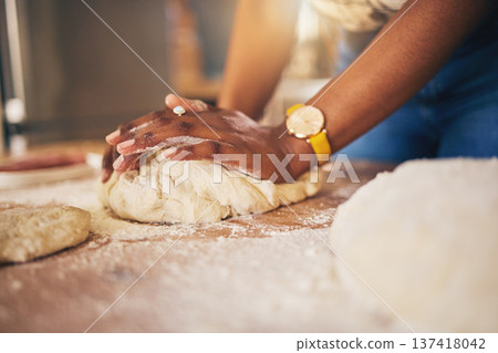 Baking, hands and woman in a kitchen for bread, pizza or handmade food at home. Wheat, mix and female chef with messy fingers from cooking, fun and preparing diy, pasta or cake recipe in her house 137418042