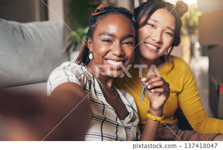 Keys, couple of friends and new home selfie for moving in together for real estate investment. Rent, mortgage and loan of women with smile for social media portrait at apartment or house with partner 137418047