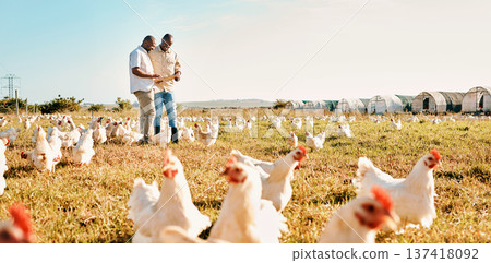 Black people, clipboard and farm with chicken livestock in agriculture and outdoor resources. Happy men working together for farming, sustainability and growth in supply chain in the countryside Black people, clipboard and farm with chicken livestock in agriculture and outdoor resources. Happy men working together for farming, sustainability and growth in supply chain in the countryside 137418092