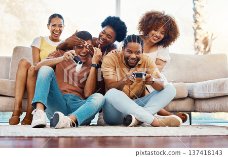 Group of friends on couch, video games for fun and relax in home living room together with internet controller. Online gaming, playing esports app and sofa, happy gamer men and women in apartment. 137418143