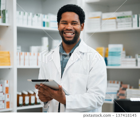 Pharmacy portrait, pharmacist man and tablet in medicine management, stock research or inventory shelf. Digital technology, retail software and healthcare doctor or african person in medical services Pharmacy portrait, pharmacist man and tablet in medicine management, stock research or inventory shelf. Digital technology, retail software and healthcare doctor or african person in medical services 137418145
