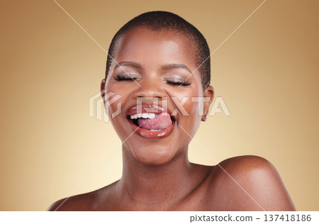 Beauty, makeup and a woman lick lips in studio for skin care, glow and cosmetics. Face of a happy african person or aesthetic model with facial shine, dermatology and wellness on a beige background Beauty, makeup and a woman lick lips in studio for skin care, glow and cosmetics. Face of a happy african person or aesthetic model with facial shine, dermatology and wellness on a beige background 137418186