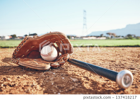 Glove, bat and baseball gear on the sand for a game, professional competition or sports. Ground, fitness and equipment for a match, fitness or training for softball on the sand in summer for cardio 137418217