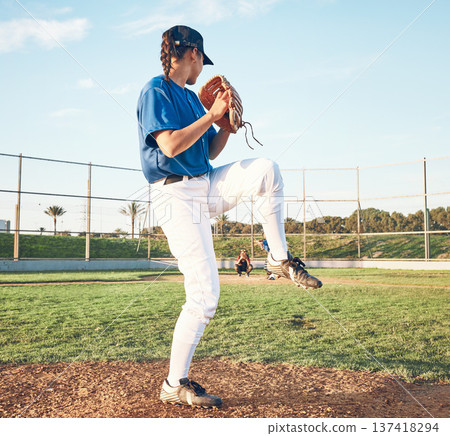 Sports person, pitching and baseball outdoor on pitch for performance and competition. Behind professional athlete or softball player for team game, training or exercise challenge at field or stadium Sports person, pitching and baseball outdoor on pitch for performance and competition. Behind professional athlete or softball player for team game, training or exercise challenge at field or stadium 137418294