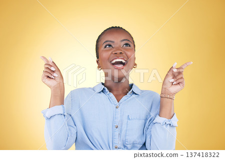 Pointing up, choice or excited black woman in studio for mockup space, sale news or deal offer. Yellow background, advertising or happy person thinking of promotion ideas, announcement or retail deal Pointing up, choice or excited black woman in studio for mockup space, sale news or deal offer. Yellow background, advertising or happy person thinking of promotion ideas, announcement or retail deal 137418322