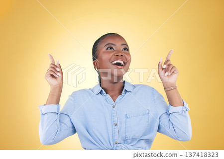 Black woman, excited and surprise, pointing up and advertising with presentation news isolated on yellow background. Announcement, opportunity and offer with wow, communication and ads in studio Black woman, excited and surprise, pointing up and advertising with presentation news isolated on yellow background. Announcement, opportunity and offer with wow, communication and ads in studio 137418323