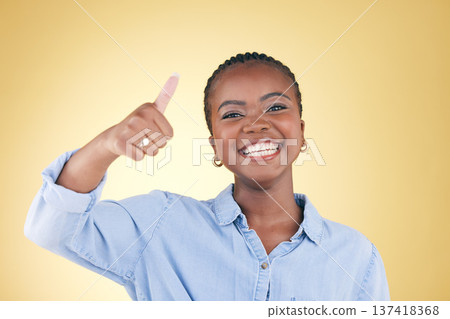 Black woman, portrait and thumbs up, feedback and support with smile isolated on yellow background. Happy, agreement and hand gesture with positive review, yes and like emoji with success in a studio 137418368
