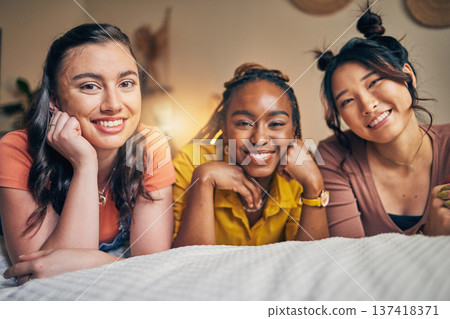 Portrait of women, friends on bed with smile and bonding in apartment together in support, trust and solidarity. Relax, love and friendship, girls in bedroom with diversity, pride and people in home. 137418371