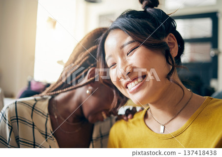 Happy, laughing and lesbian couple talking at their home with a funny or comedy joke. Happiness, love and interracial lgbtq women with a smile for bonding in the living room of their modern apartment 137418438