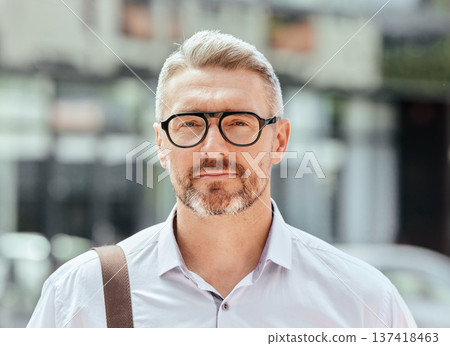 Mature business man, city and portrait with glasses, bag and ready for walk, travel and outdoor in metro. Entrepreneur, CEO or manager in road, traffic or sidewalk with pride on serious face in Milan Mature business man, city and portrait with glasses, bag and ready for walk, travel and outdoor in metro. Entrepreneur, CEO or manager in road, traffic or sidewalk with pride on serious face in Milan 137418463