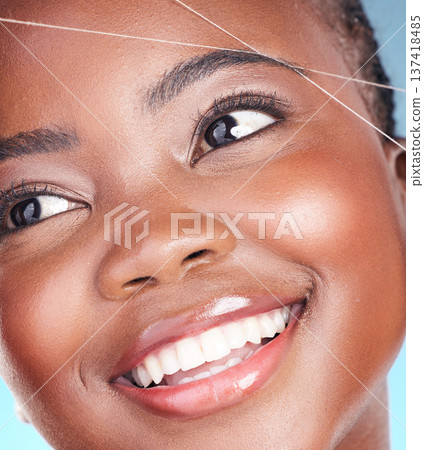 Thread, eyebrow plucking and beauty of a woman with dermatology, natural makeup and smile. Face of an African person on a studio background with cosmetics, hair removal and facial glow or self care Thread, eyebrow plucking and beauty of a woman with dermatology, natural makeup and smile. Face of an African person on a studio background with cosmetics, hair removal and facial glow or self care 137418485