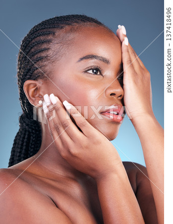Beauty, black woman and thinking with skincare, cosmetics and facial wellness in a studio. Blue background, makeup and dermatology with skin glow and shine from treatment with manicure and detox 137418496