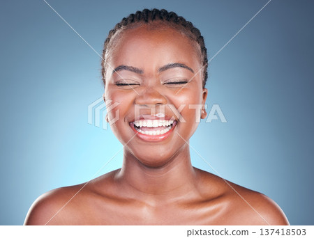 Beauty, skincare and black woman with laughing, cosmetics and makeup in studio. Wellness, African female model and funny with blue background and skin glow with shine from dermatology and treatment 137418503
