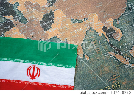National flag of Iran on the world map background. Iran and USA war. Crisis and terrorism. National flag of Iran on the world map background. Iran and USA war. Crisis and terrorism. 137418730