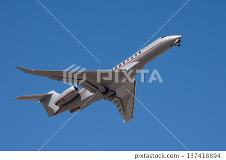 Small business jet, an airplane taking off in the air. Private jet Small business jet, an airplane taking off in the air. Private jet 137418894