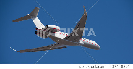 Small business jet, an airplane taking off in the air. Private jet Small business jet, an airplane taking off in the air. Private jet 137418895