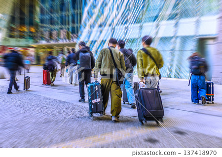 Tokyo cityscape in Japan: Suitcases... Inbound tourism continues... Foreign tourists moving around in front of Tokyo Station (Nihonbashi Exit)... 137418970