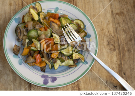 sauteed mixed vegetables with fork on plate for healthy meal sauteed mixed vegetables with fork on plate for healthy meal 137420246