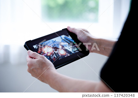 Play games on a tablet Play games on a tablet 137420348