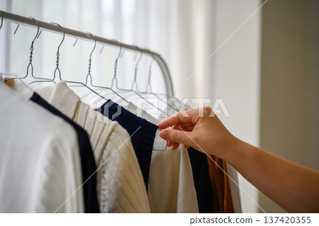 Choosing clothes for your closet 137420355