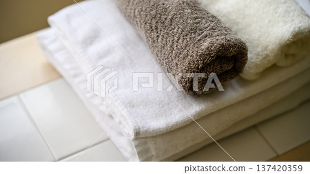 Clean towels piled up 137420359