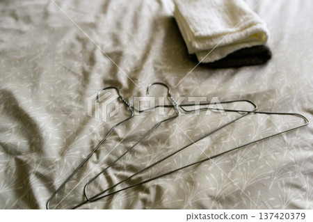 Hangers and folded towels Hangers and folded towels 137420379