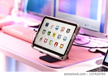 Tablet and peripherals on a desk 137420765
