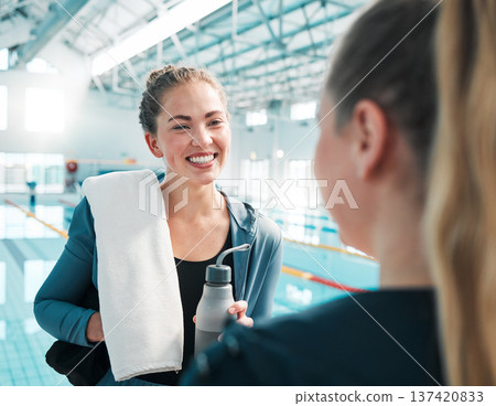 Happy woman, friends and meeting in swimming sports fitness, exercise or training together at indoor pool. Female person or professional swimmers talking in happiness for competition or teamwork Happy woman, friends and meeting in swimming sports fitness, exercise or training together at indoor pool. Female person or professional swimmers talking in happiness for competition or teamwork 137420833