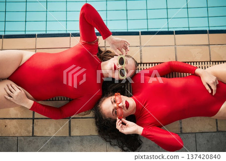 Sunglasses, swimwear and fashion women or friends in red bodysuit at indoor swimming pool. Portrait above young people relax with sports aesthetic, style and art or luxury in designer clothes 137420840
