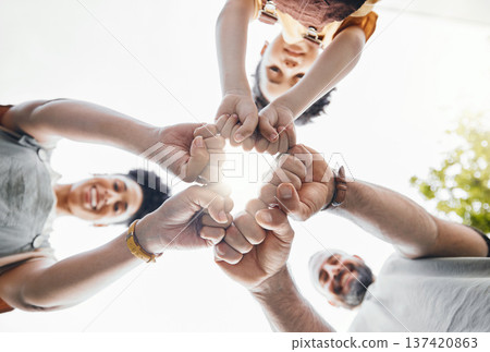 Family, fist bump and circle outdoor together in low angle, happy and bonding. Father, mother and child hands in huddle to love, solidarity and parents support in cooperation, connection and success Family, fist bump and circle outdoor together in low angle, happy and bonding. Father, mother and child hands in huddle to love, solidarity and parents support in cooperation, connection and success 137420863