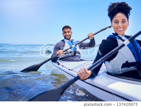 Water, man and woman in kayak at lake, beach or river for exercise in sports at sea in portrait. Ocean holiday, adventure and fitness, happy couple with smile rowing in canoe at training or challenge Water, man and woman in kayak at lake, beach or river for exercise in sports at sea in portrait. Ocean holiday, adventure and fitness, happy couple with smile rowing in canoe at training or challenge 137420873