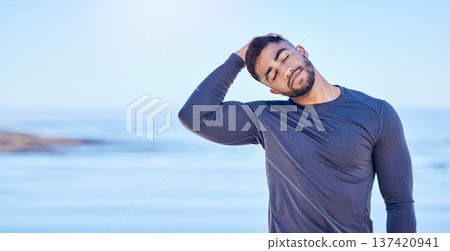 Beach, exercise and man stretching neck for outdoor freedom, sports workout or advertising space. Blue sky mockup, ocean water and Indian person start relax training warm up, challenge or muscle care Beach, exercise and man stretching neck for outdoor freedom, sports workout or advertising space. Blue sky mockup, ocean water and Indian person start relax training warm up, challenge or muscle care 137420941