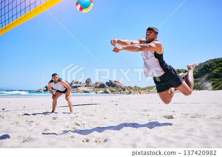 Man, game and playing volleyball on beach in sports, match or score point in outdoor fitness or exercise. Active male person in teamwork, spike or ball over net in practice or training on ocean coast Man, game and playing volleyball on beach in sports, match or score point in outdoor fitness or exercise. Active male person in teamwork, spike or ball over net in practice or training on ocean coast 137420982