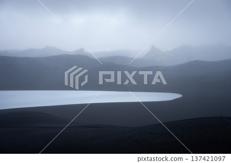 Hazy moonlike volcanic landscape covered by black sand, Highlands Iceland Hazy moonlike volcanic landscape covered by black sand, Highlands Iceland 137421097