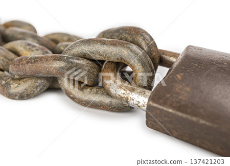 Close-Up Image of an Aged, Weathered Metal Chain Secured with a Rusted locked Padlock, Illustrating Concepts of Security, Strength, and Durability 137421203