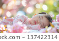 Portrait of a cute baby taking a nap 137422314