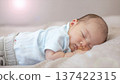 Portrait of a cute baby taking a nap 137422315