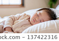 Portrait of a cute baby taking a nap 137422316