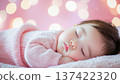 Portrait of a cute baby taking a nap 137422320