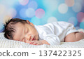 Portrait of a cute baby taking a nap 137422325