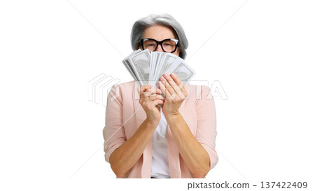 Senior woman holding cash covering face on transparent background Senior woman holding cash covering face on transparent background 137422409